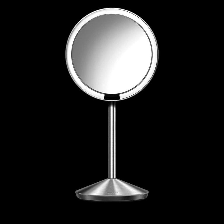 Simplehuman's Sensor Mirror Fold on a black background. 